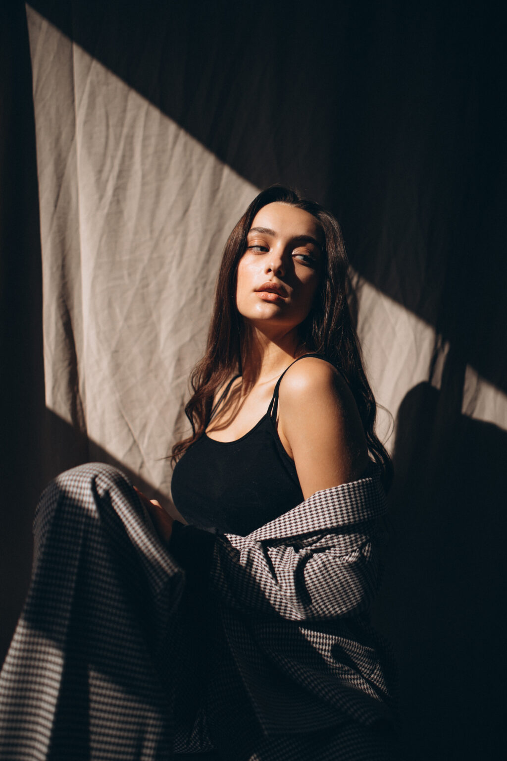 Young beautiful woman in a business suit in a studio