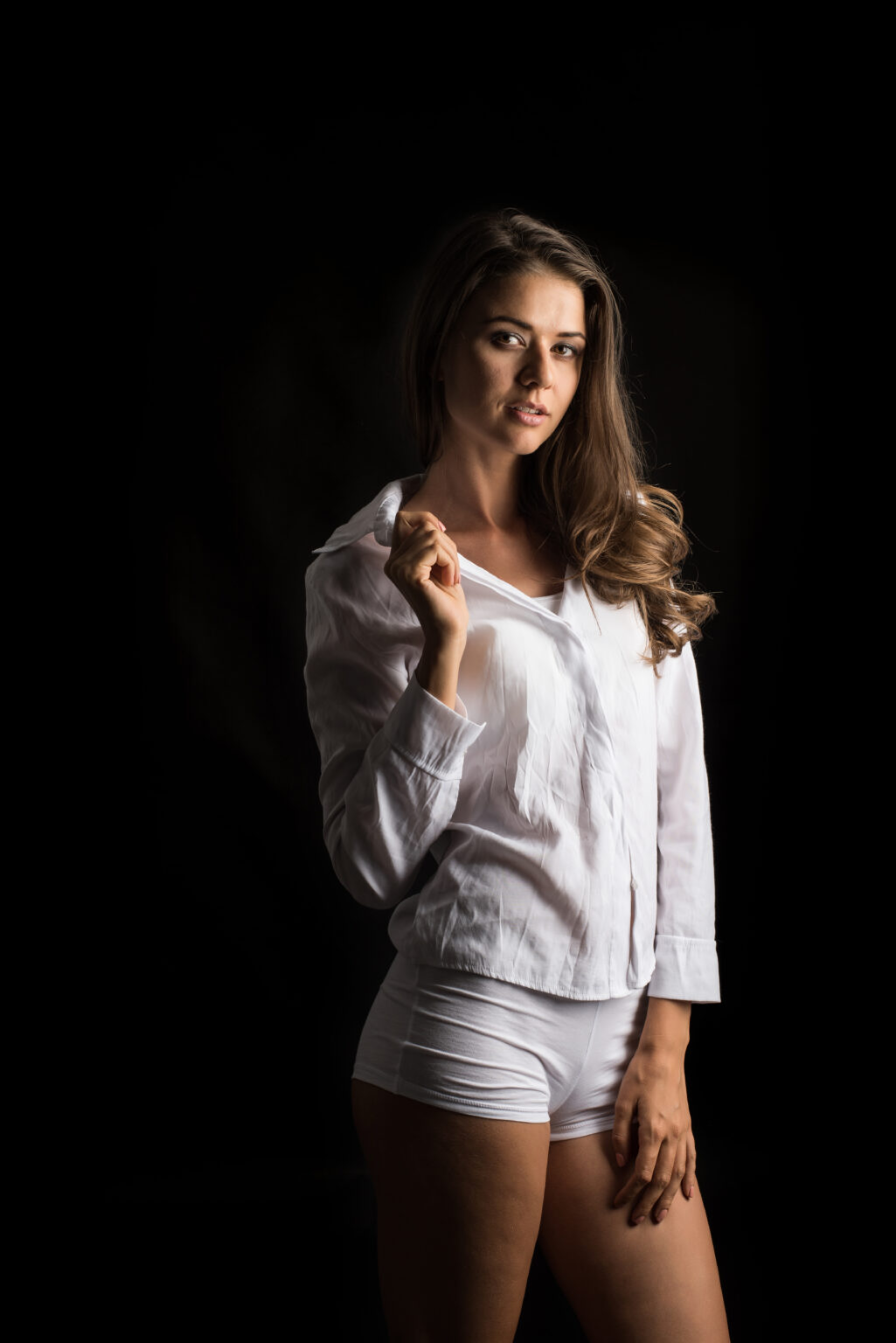 Beautiful woman with healthy body on black background